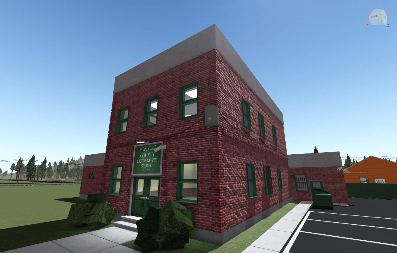 
    The Robloxia County Sherriff's Office, a 2 floor building made out of red bricks
    and green trimmings.
  